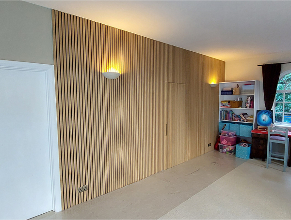 Oak panel feature wall with hidden door