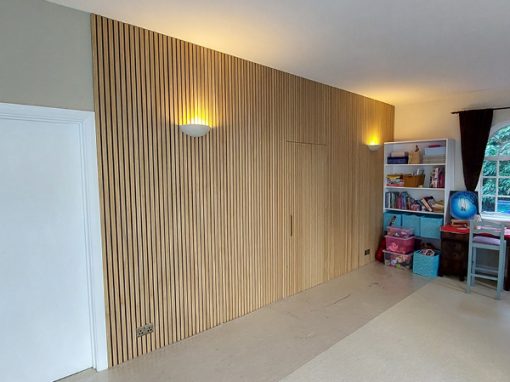 Oak panel feature wall with hidden door